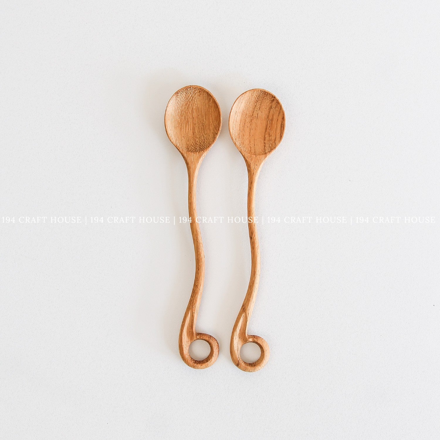 This handcrafted wooden spoon with a hole, from 194 Craft House, is a practical kitchen cooking utensil shown here in another product photo.