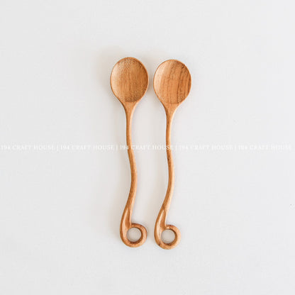 This handcrafted wooden spoon with a hole, from 194 Craft House, is a practical kitchen cooking utensil shown here in another product photo.