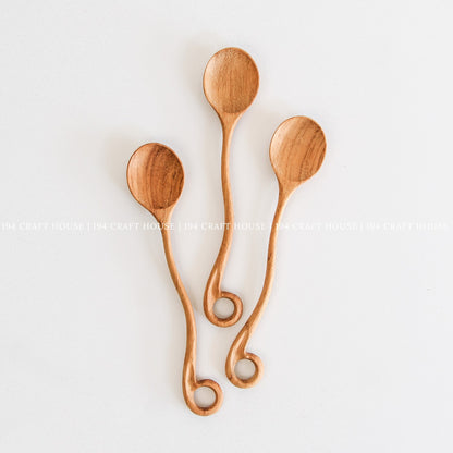 This handcrafted wooden spoon with a hole is a kitchen cooking utensil from 194 Craft House, shown here in another product photo.