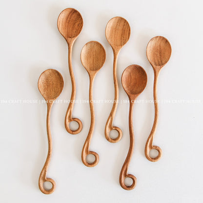 This handcrafted wooden spoon with a hole is a kitchen cooking utensil from 194 Craft House, shown here in another product photo.