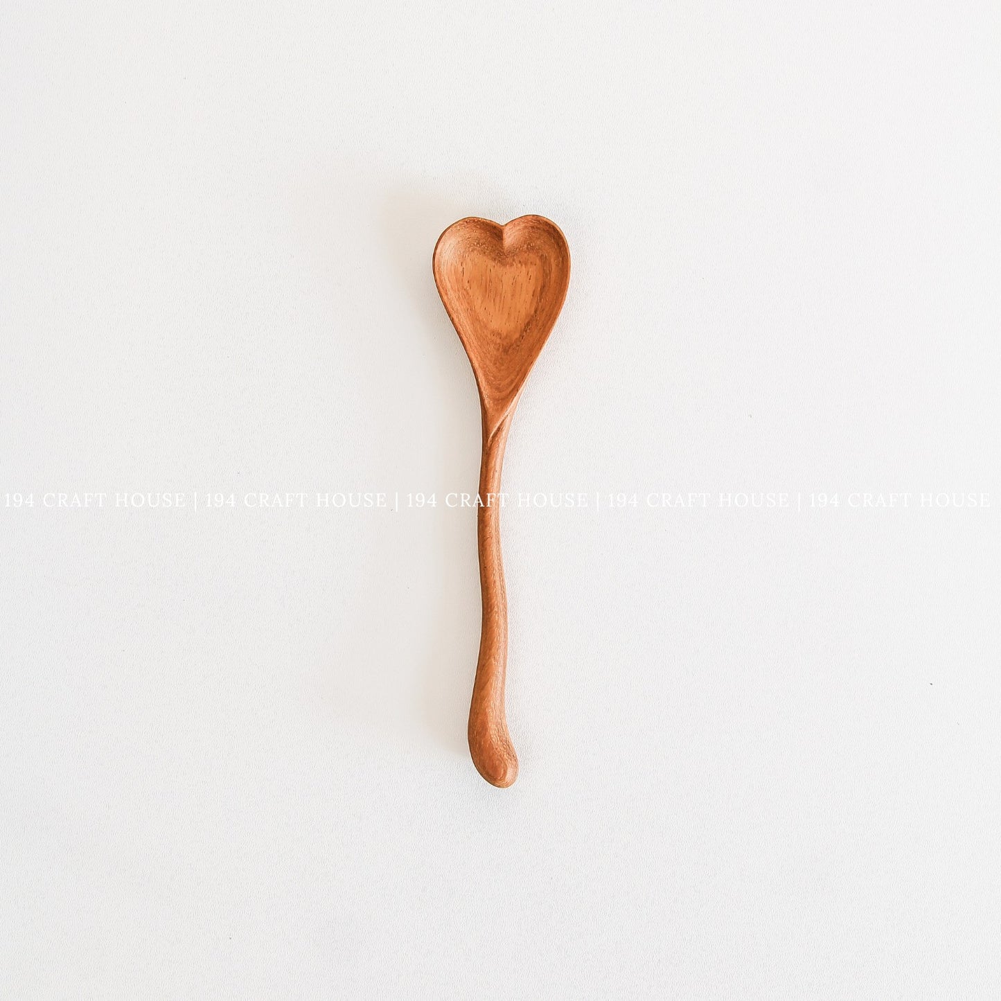 Handcrafted wooden heart-shaped spoon made from natural wood