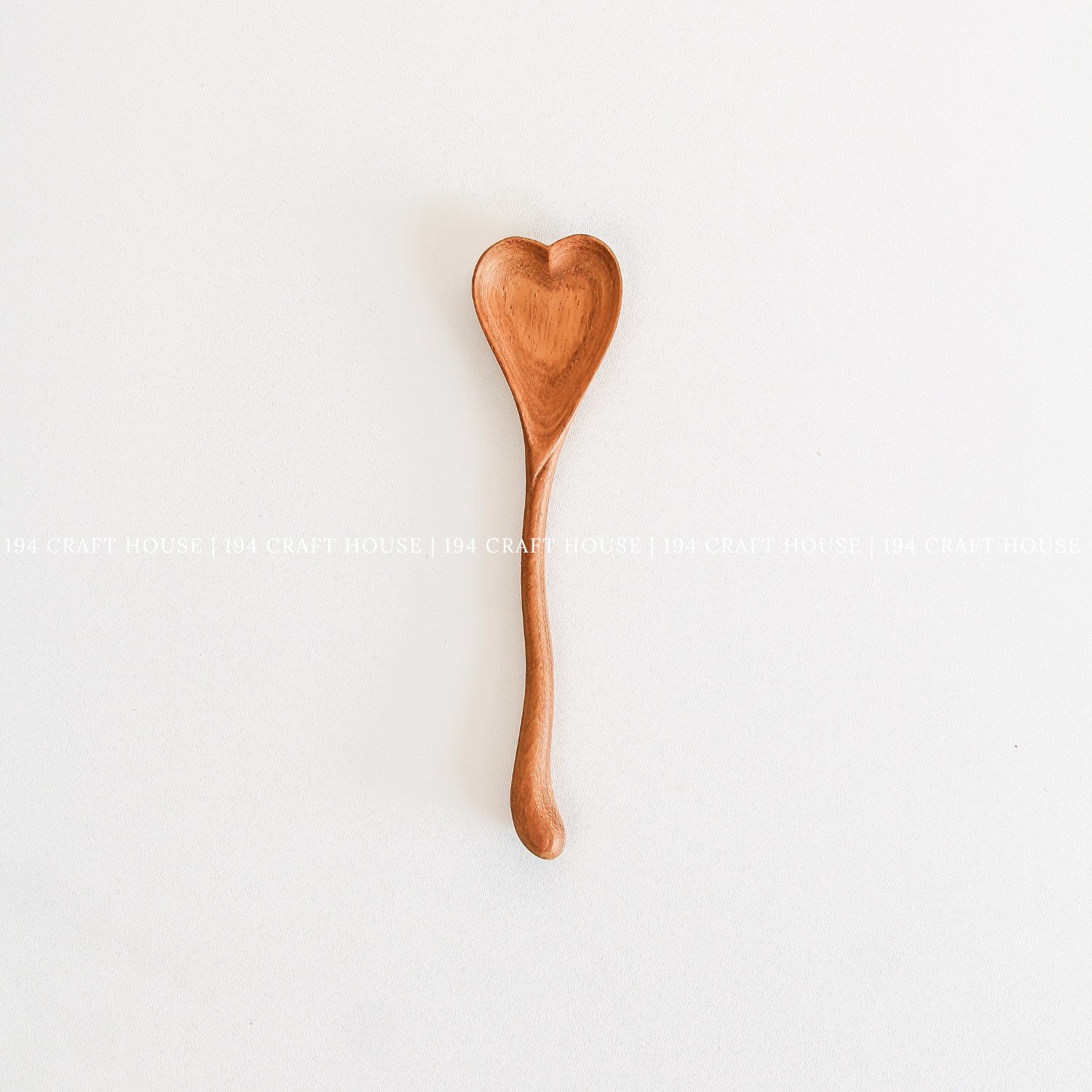 Handcrafted wooden heart-shaped spoon made from natural wood