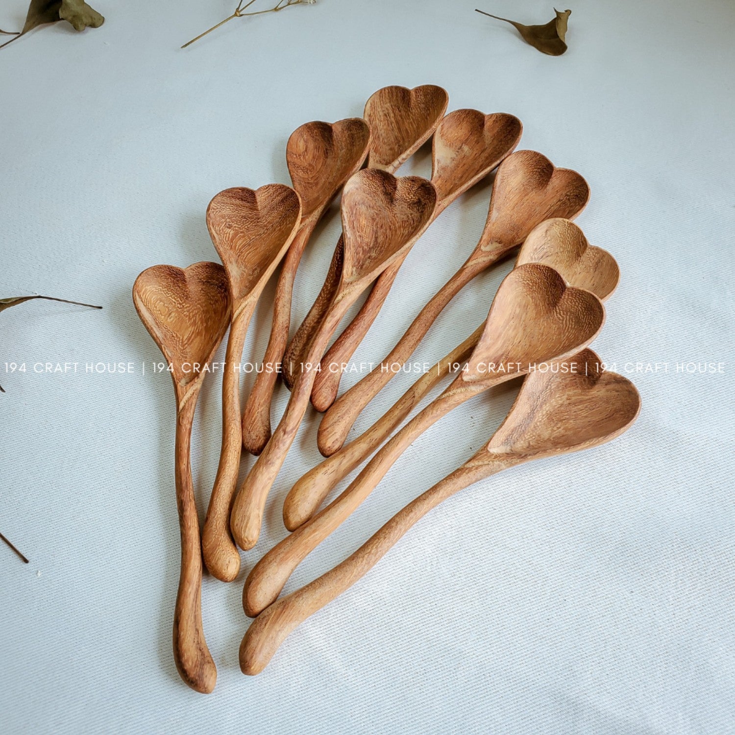Handcrafted wiggly heart-shaped wooden spoon with a unique curved handle