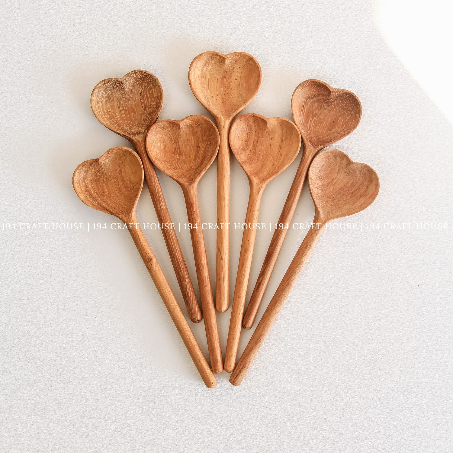 Collection of heart-shaped wooden spoons for personalized gifts and kitchen decor