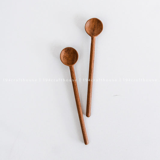 Hand-carved Doussie wood measuring spoons for coffee and tea by 194 Craft House, showcasing rustic wooden kitchen utensils on a clean white background.