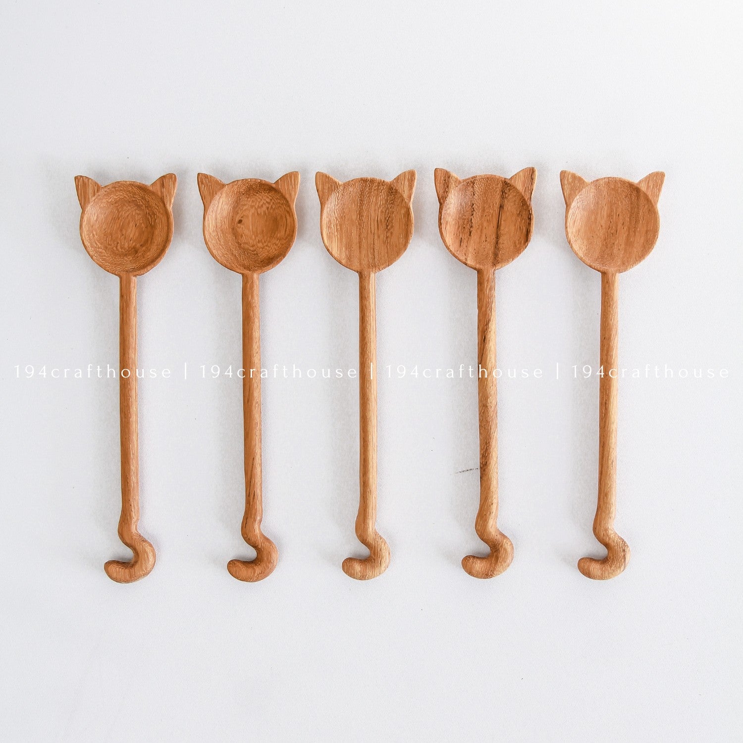 Collection of handcrafted cat-shaped wooden spoons for cat lovers and unique gifts