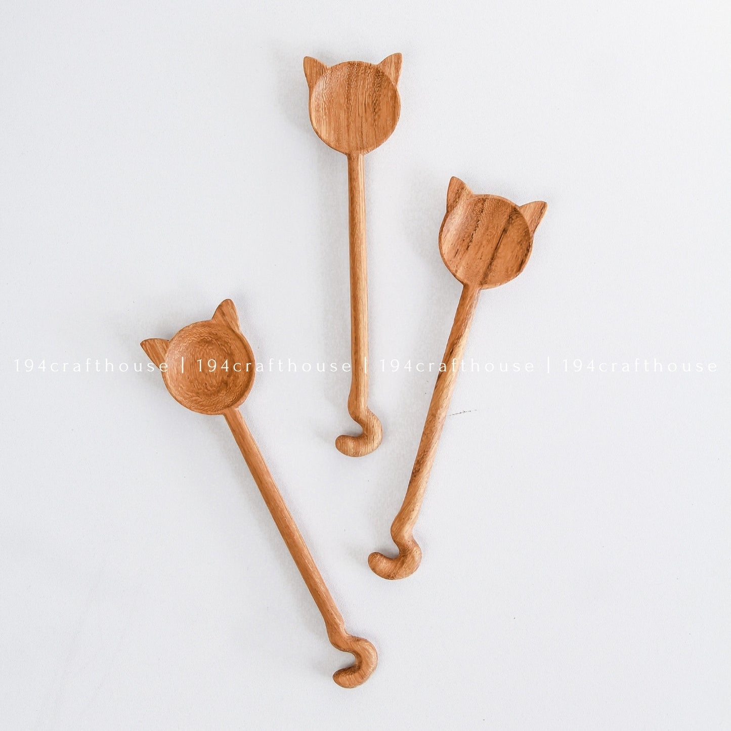 Unique handcrafted cat-shaped wooden spoons with different feline-inspired designs