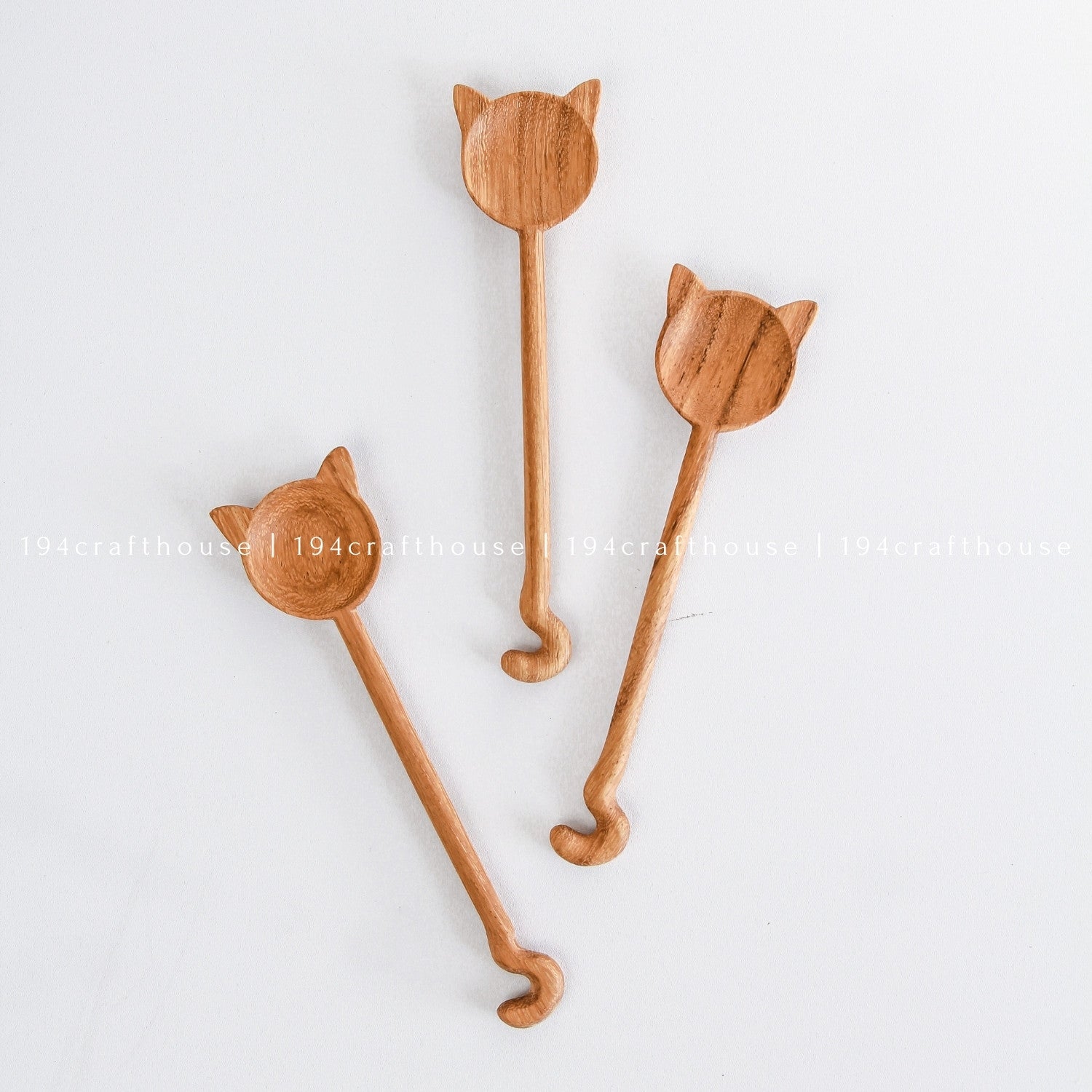 Unique handcrafted cat-shaped wooden spoons with different feline-inspired designs