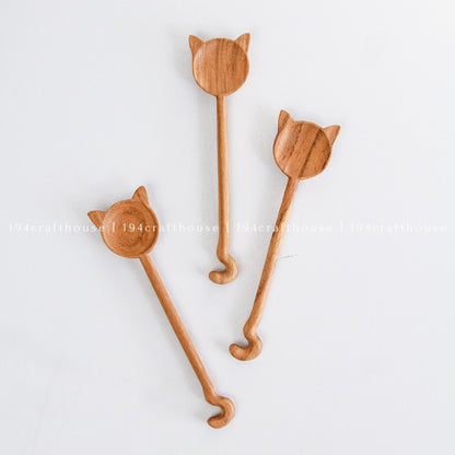 Unique handcrafted cat-shaped wooden spoons with different feline-inspired designs