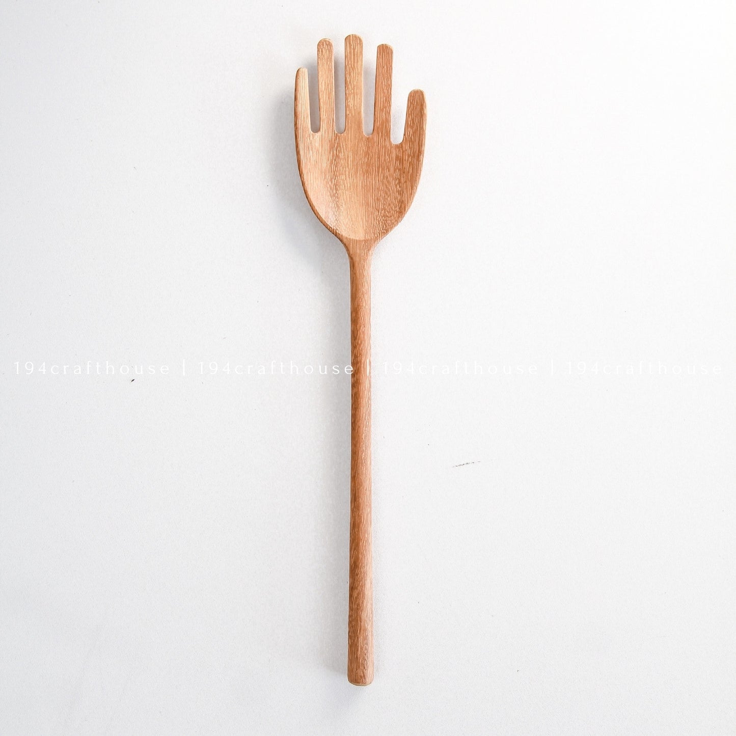 Single hand-shaped wooden serving spoon with a long handcrafted handle