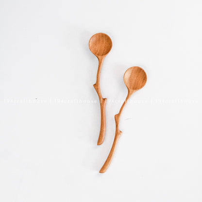 Pair of handcrafted branch handle wooden spoons with unique natural curves