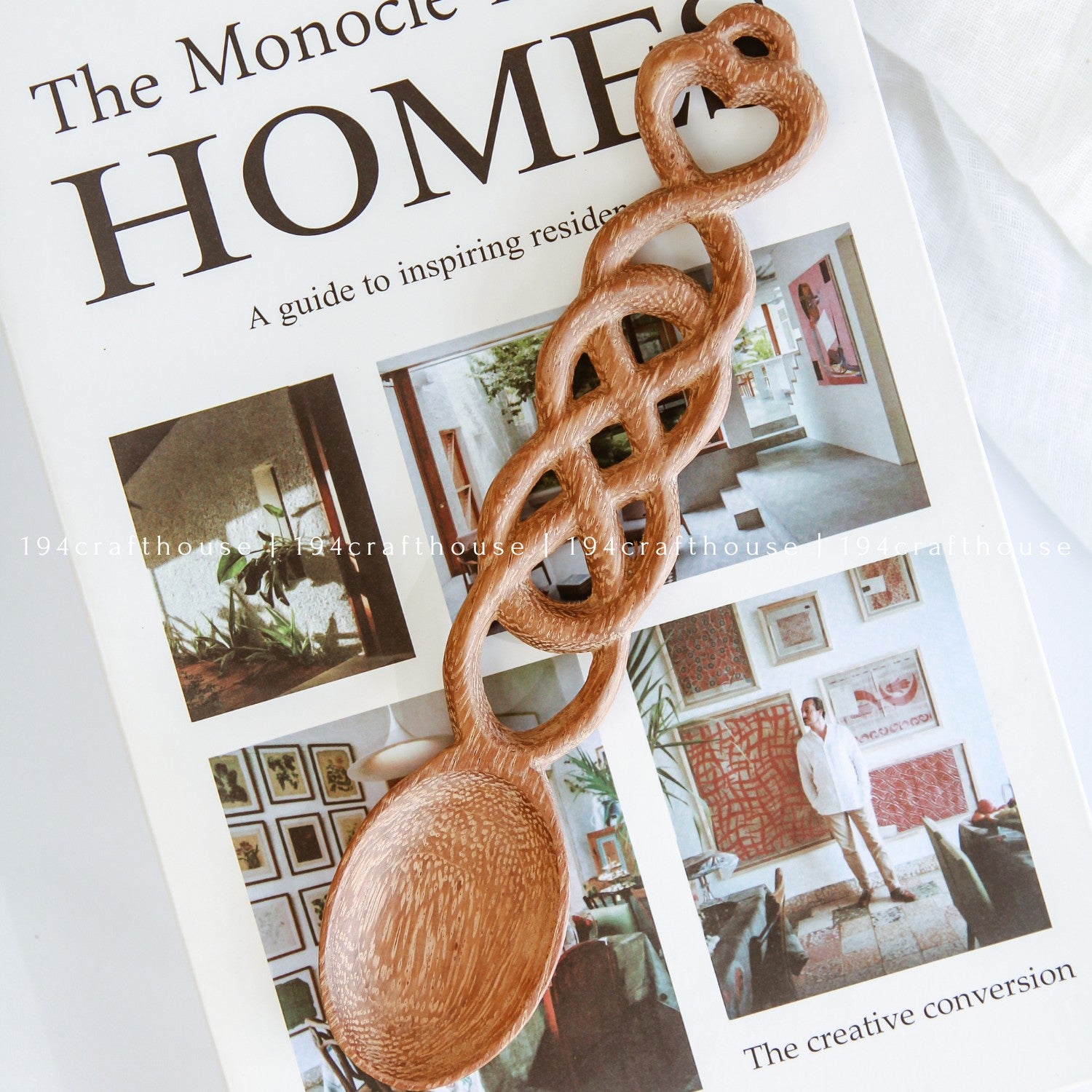 Hand-carved Welsh love spoon styled with rustic home decor and natural accessories