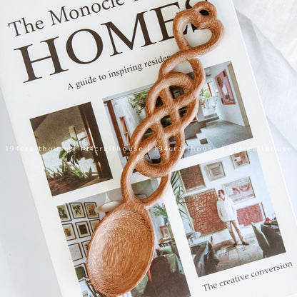 Hand-carved Welsh love spoon styled with rustic home decor and natural accessories