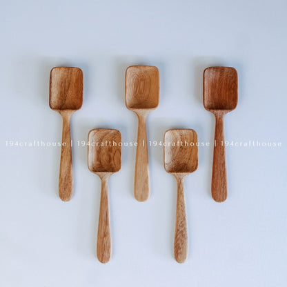 Set of five Doussie wood measuring spoons with square scoops in assorted sizes