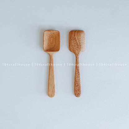 Two handcarved Doussie wood measuring spoons with square scoops in different sizes