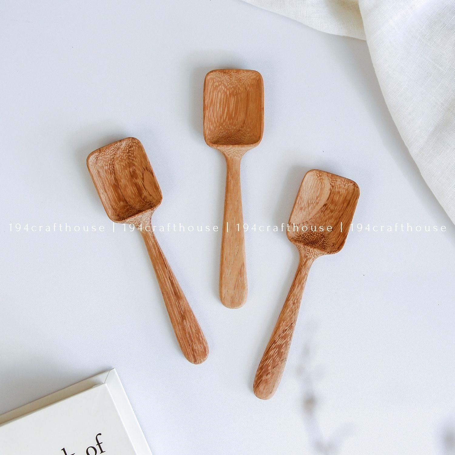 Handcarved Doussie wood measuring spoons with square scoops in assorted sizes