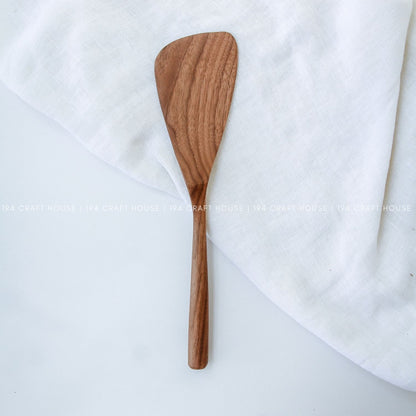 Handcrafted 12-inch walnut wood cooking spatula with a smooth tapered head