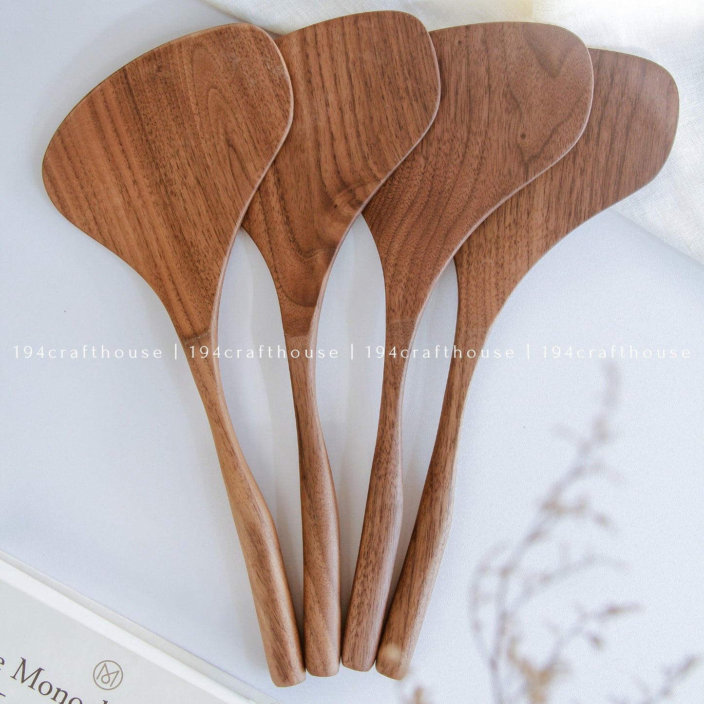 Collection of large handcrafted wooden cooking spatulas for stirring and serving