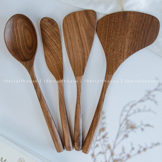 Set of four walnut wooden spoons and spatulas - kitchen serving utensils on a white background with '194 Craft House' branding.