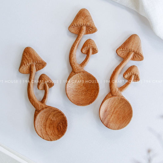 Hand-carved cottagecore mushroom wooden spoons with whimsical woodland designs