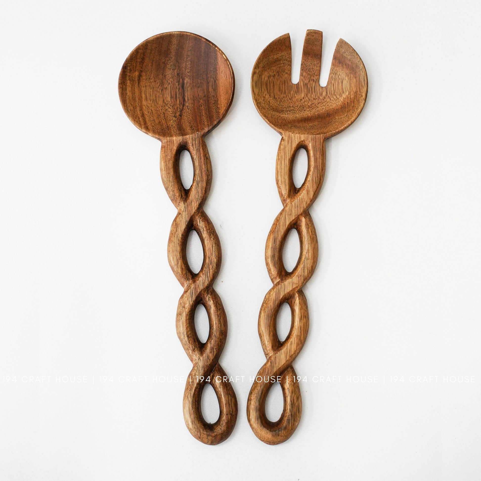 Handcrafted wooden salad server set with unique chain-link handles and natural wood grain