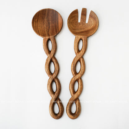 Handcrafted wooden salad server set with unique chain-link handles and natural wood grain