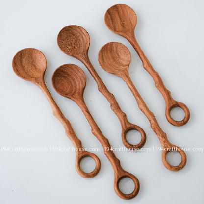 Handcrafted branch-tree wooden spoons showcasing smooth finishes and unique natural wood grain variations