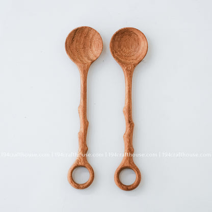 Set of two handcrafted branch-tree wooden stirring spoons with decorative hole handles