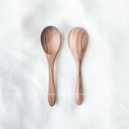 Set of two handcrafted 6-inch walnut wooden spoons displayed from the front with beautiful natural walnut wood grain