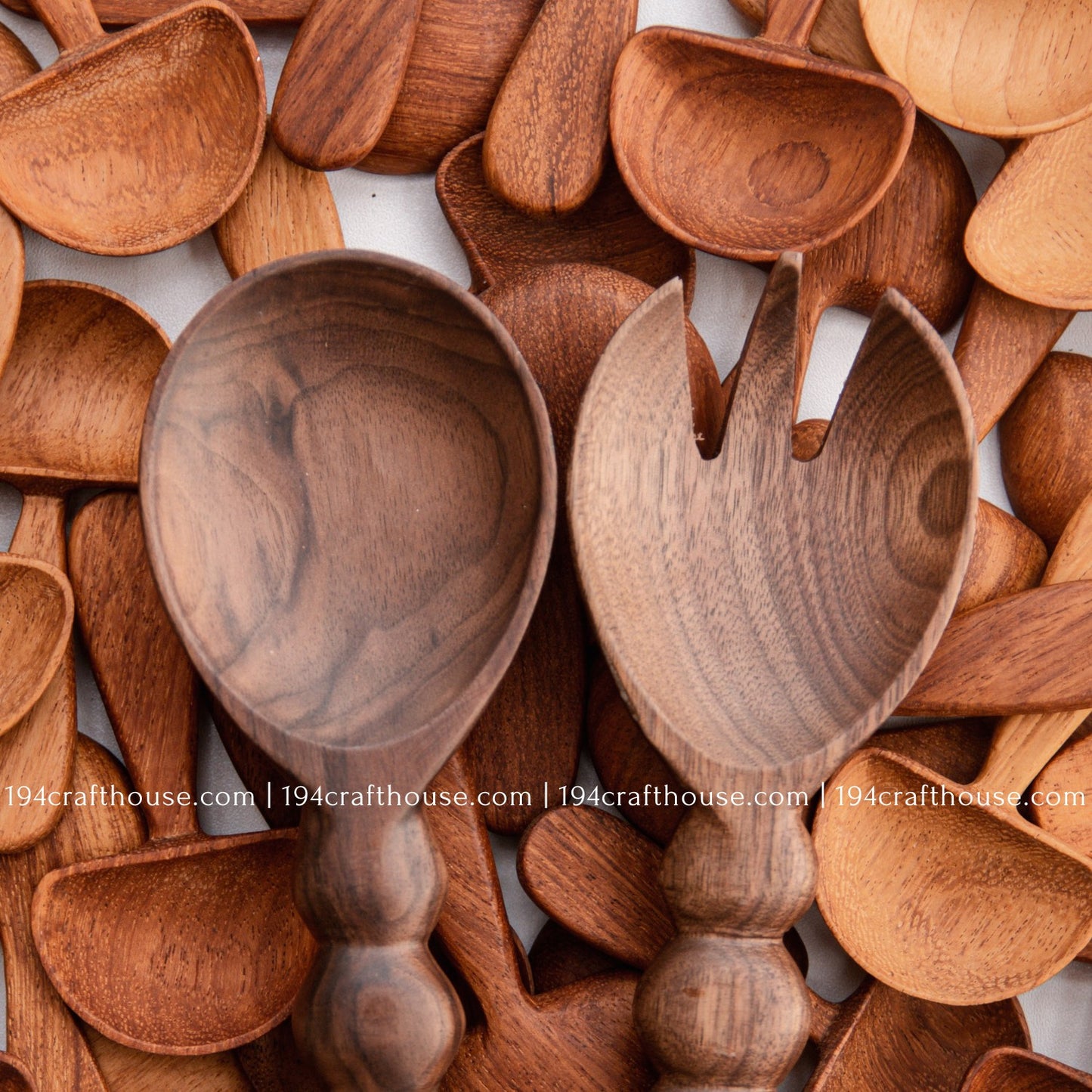 Handcrafted walnut wood salad server sets showing natural grain variations