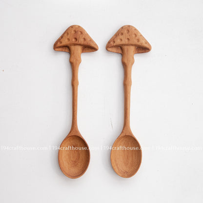 Pair of hand-carved mushroom wooden spoons with natural wood grain