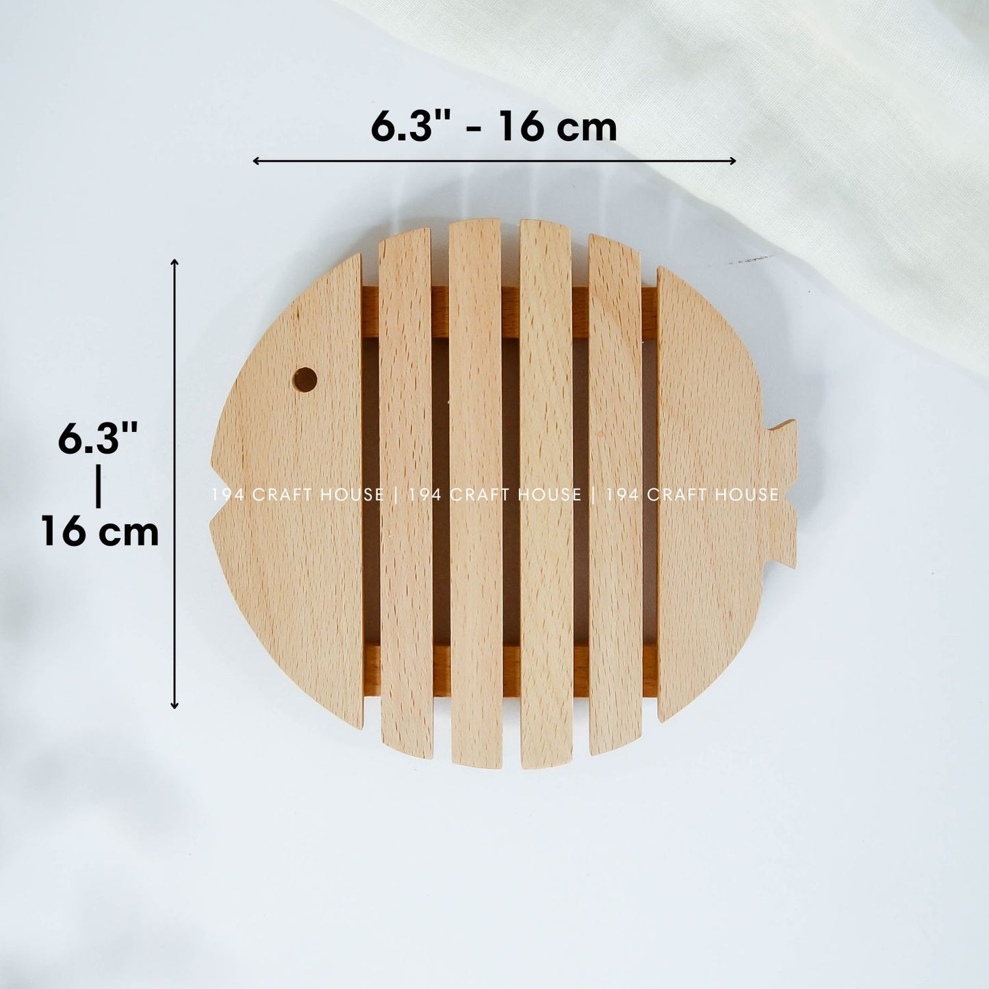 Fish-shaped wooden trivet with detailed measurements and handcrafted slatted design