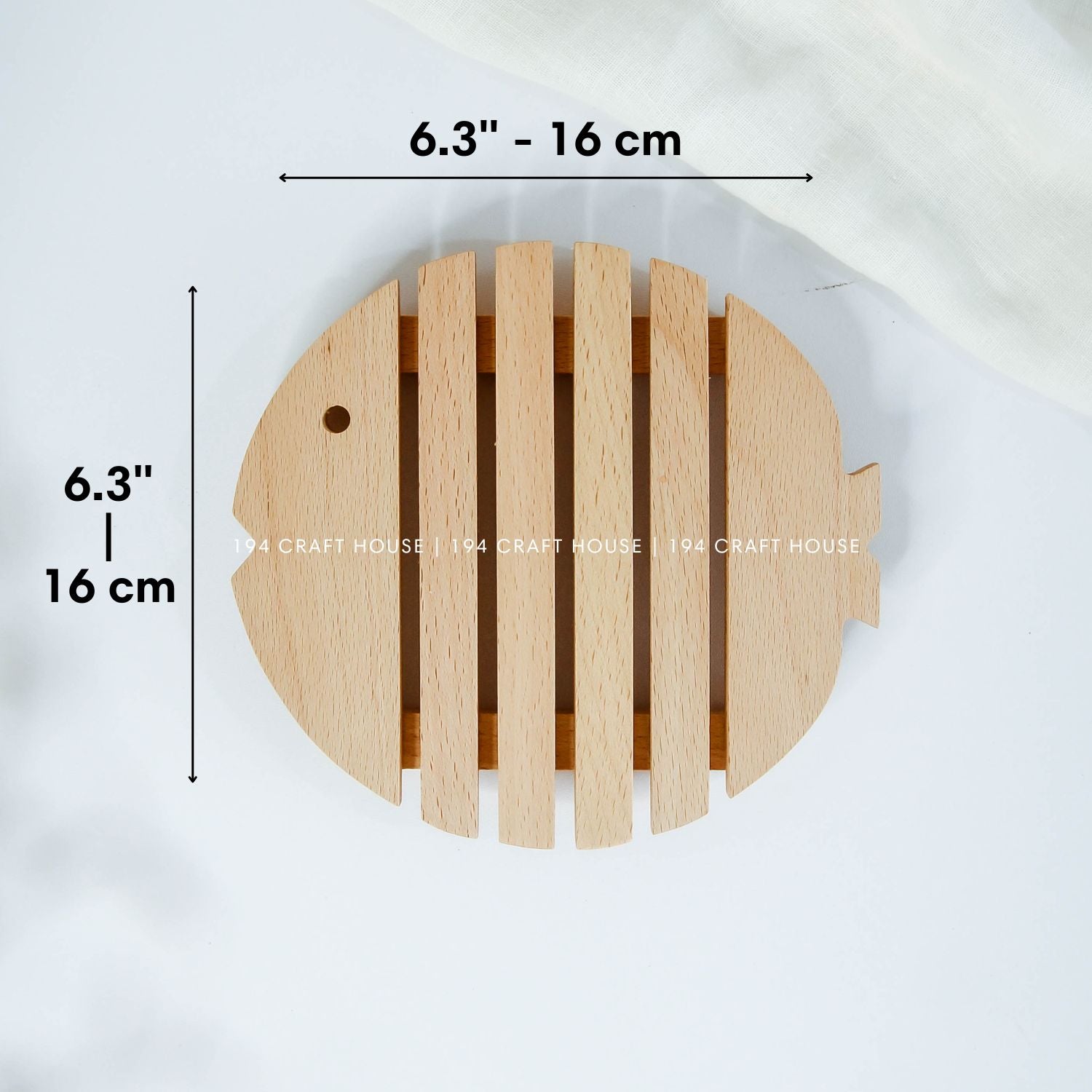 Fish-shaped wooden trivet with detailed measurements and handcrafted slatted design