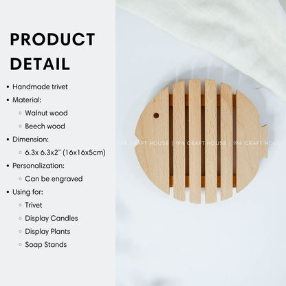 Wooden fish-shaped trivet with product dimensions and size details for kitchen and dining use