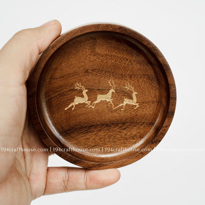 Front view of a handmade walnut wood ring tray with deer trio engraving and smooth handcrafted finish