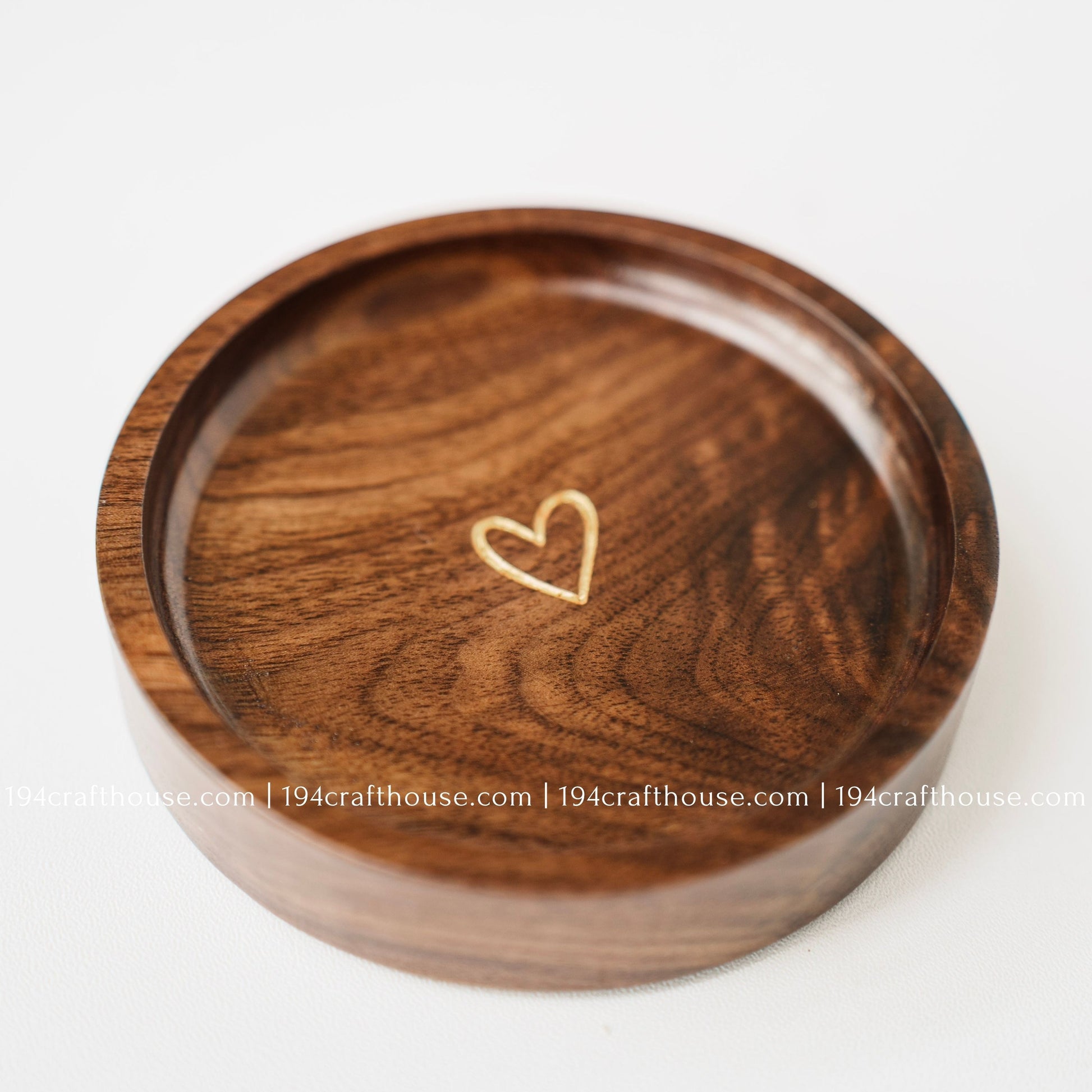 Walnut wood jewelry tray with gold heart detail showcasing unique natural grain and handcrafted variations