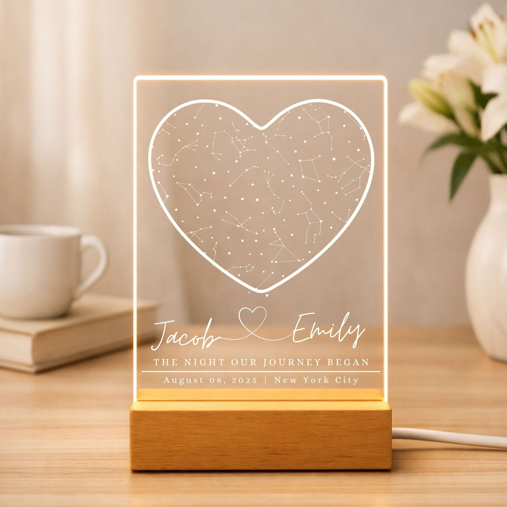 Minimalist wooden LED base holding a glowing acrylic star map with custom name, date and location.