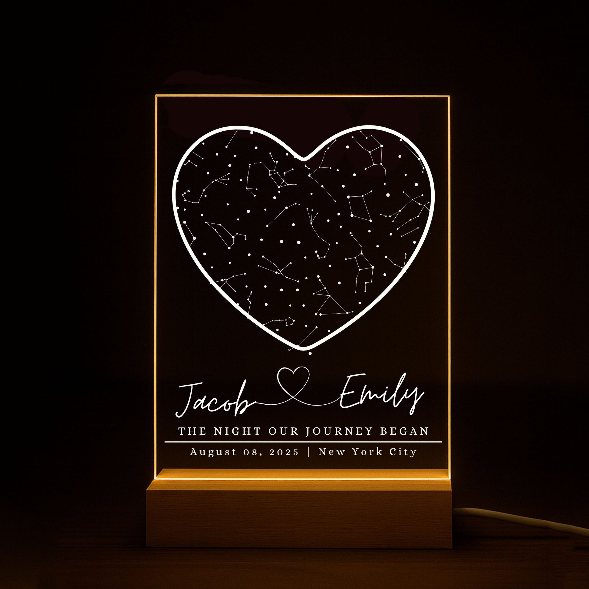 LED star map lamp with a warm yellow glow illuminating personalized names, location and date