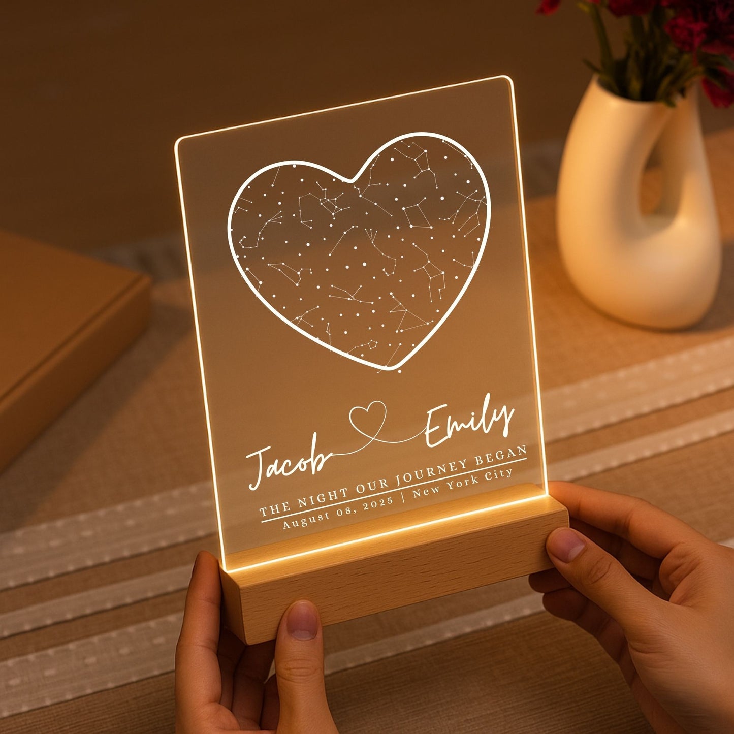 Handheld photo of a personalized star map light to demonstrate size and portability