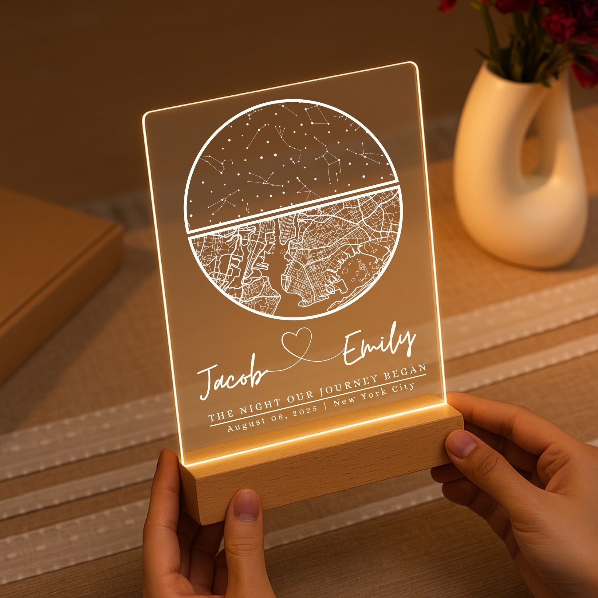Custom street map night light glowing on a nightstand in a cozy, dimly lit bedroom.
