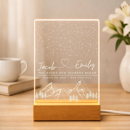 Custom star map engraved on a sleek acrylic plaque with a minimalist wooden LED base.
