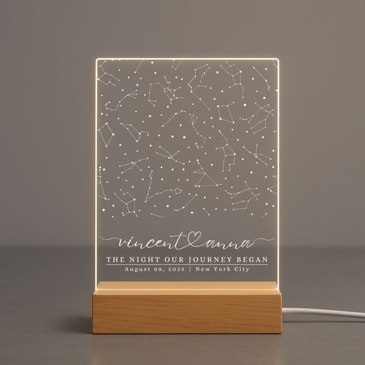 Elegant star map night light casting soft shadows on a grey surface.