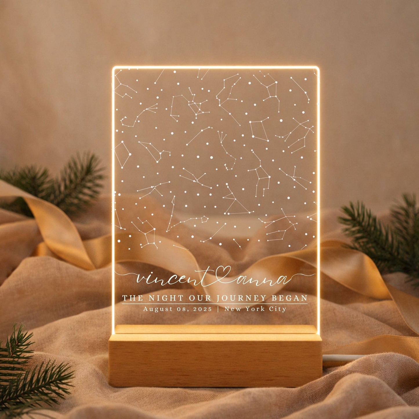 A cozy bedroom setting featuring a personalized "The Night Our Journey Began" lamp illuminating