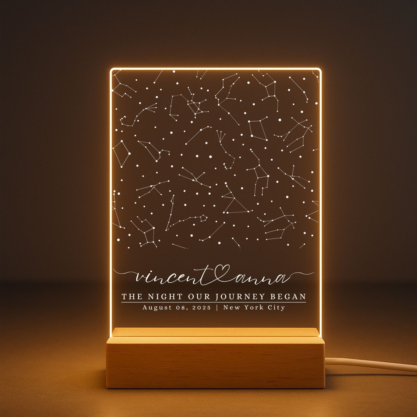a glowing "The Night Our Journey Began" acrylic lamp to show its warm lighting