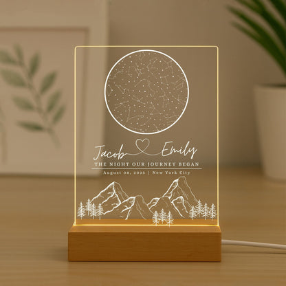 a glowing personalized star map night light for a spouse standing in the table home decor