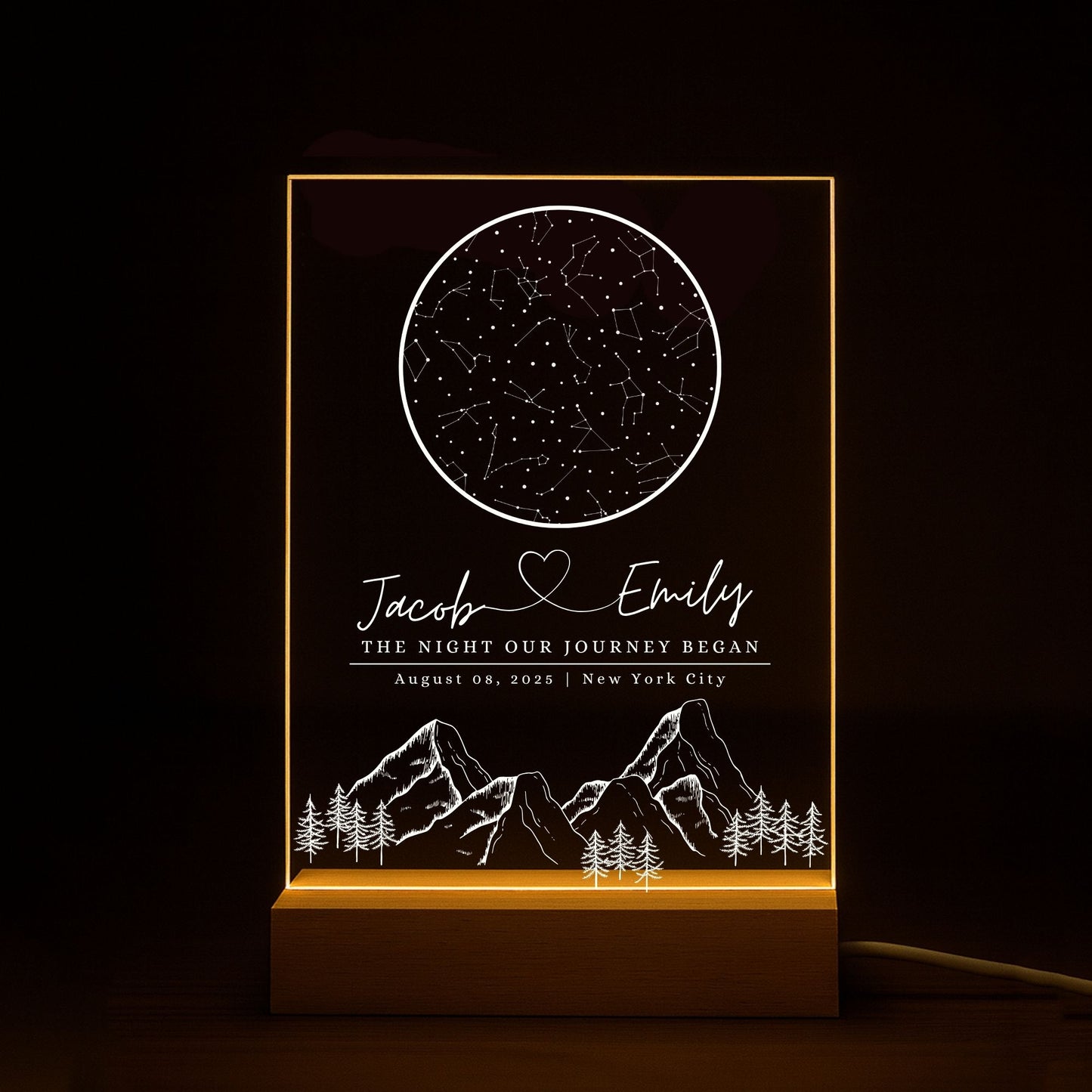 Engagement gift idea: a star map night light engraved with "The Night Our Journey Began" and location coordinates.
