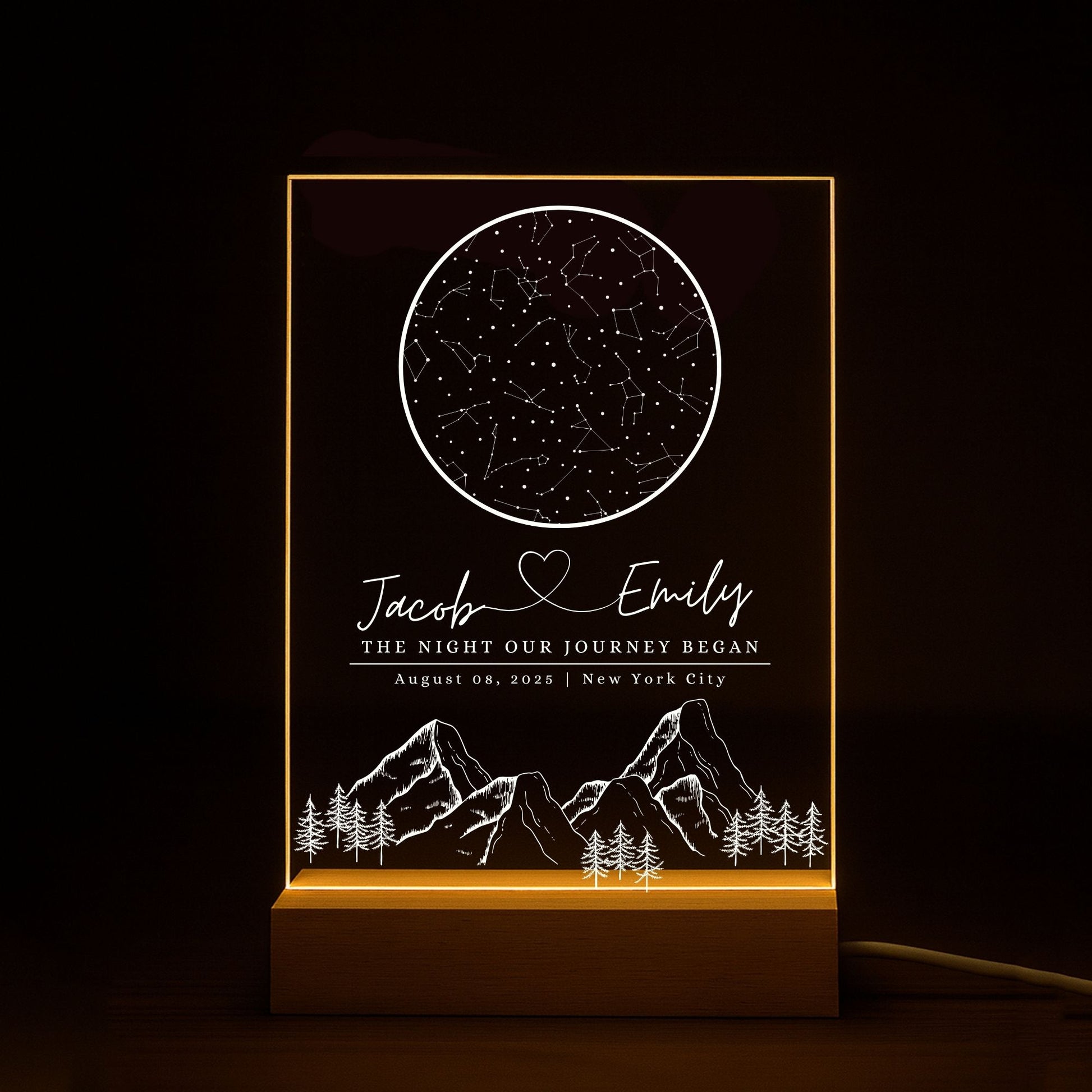 Engagement gift idea: a star map night light engraved with "The Night Our Journey Began" and location coordinates.