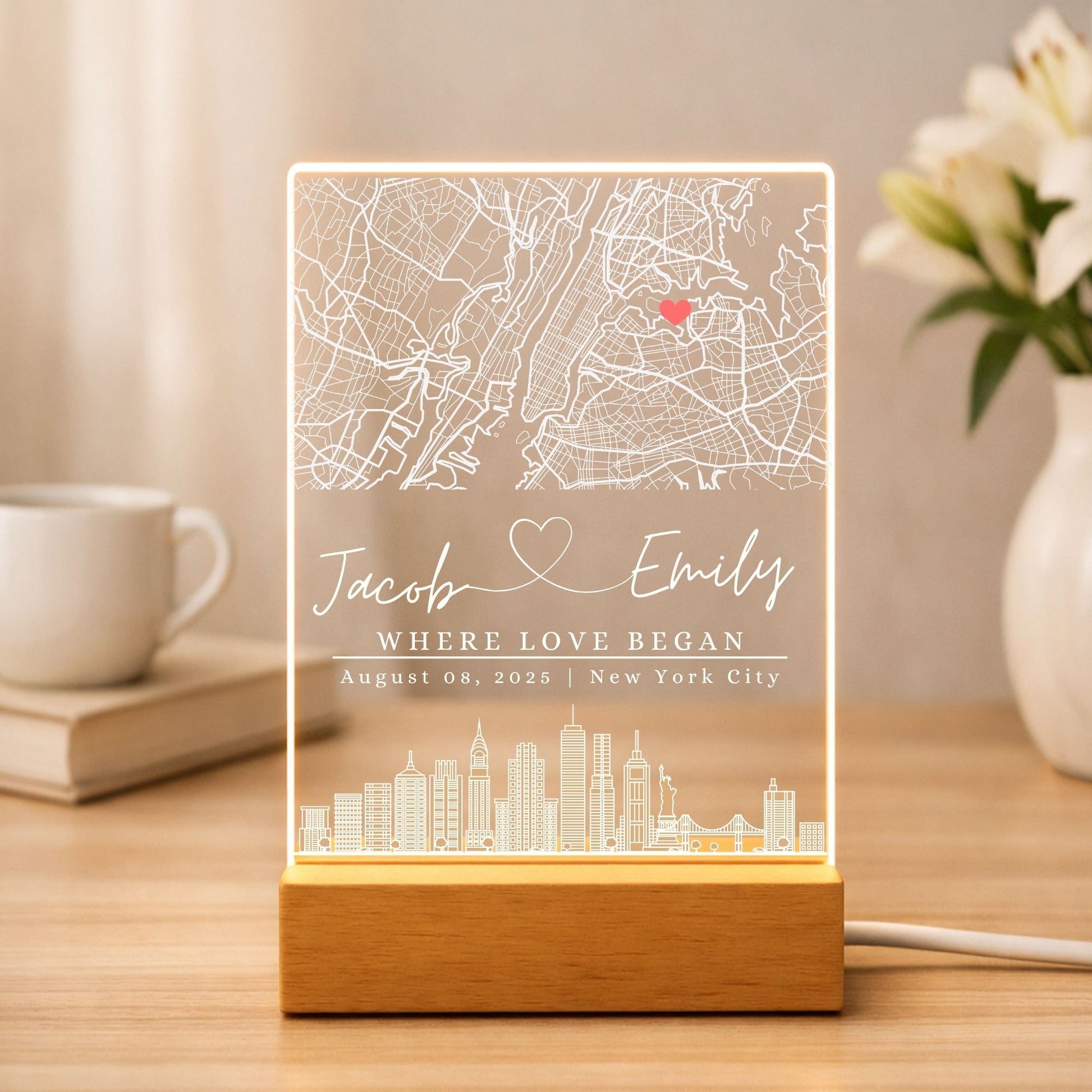 Modern home office decor featuring a custom "Where love began" acrylic street map.