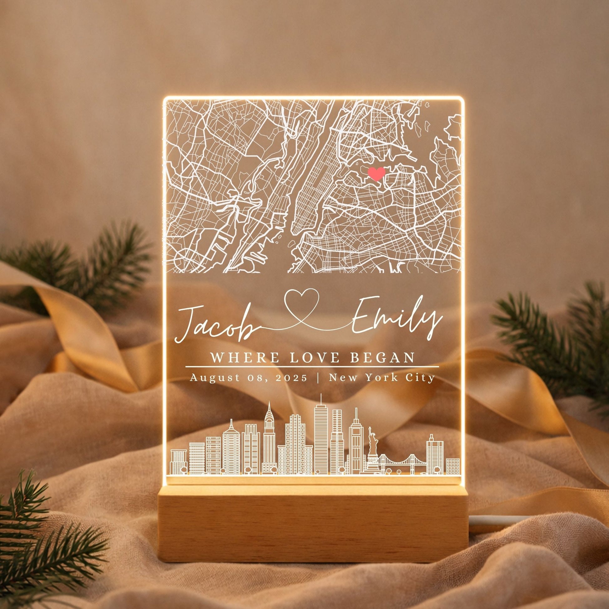 a street map night light next to a wedding photo and dried flowers
