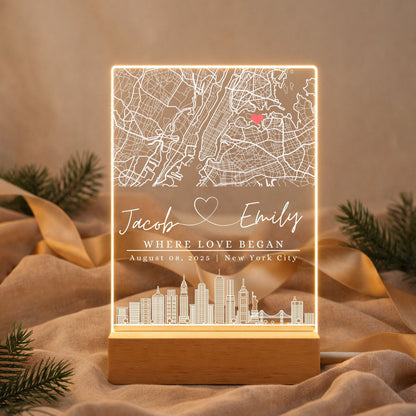 a street map night light next to a wedding photo and dried flowers